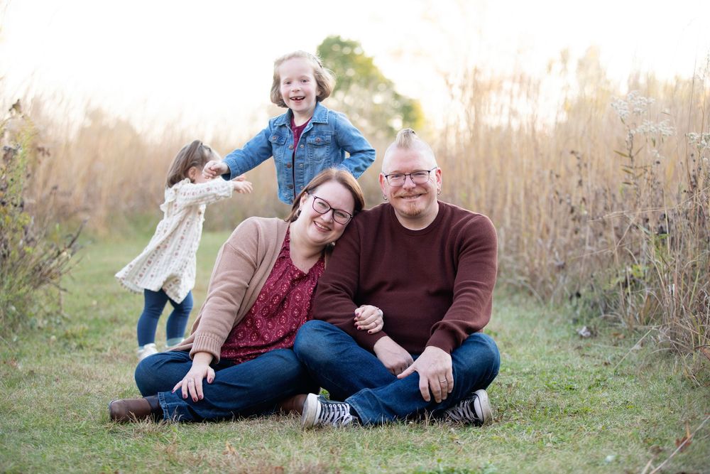 Downers Grove Family Photography photo of family laughing and playing in field during the fall by Julie Chen Photography