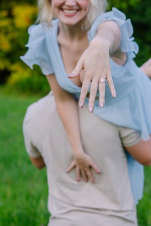 Series showing joyful reactions and ring display in a sunny outdoor setting.