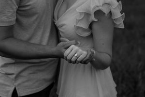 Black and white sequence capturing intimate moments during an engagement photoshoot.