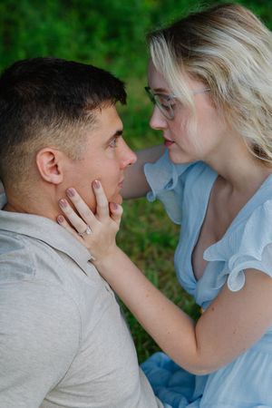 Close up sequence of an intimate moment between a couple in casual attire outdoors.