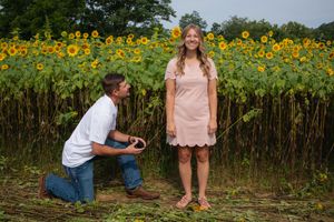 A series of proposal photos captured in front of a vibrant sunflower field.