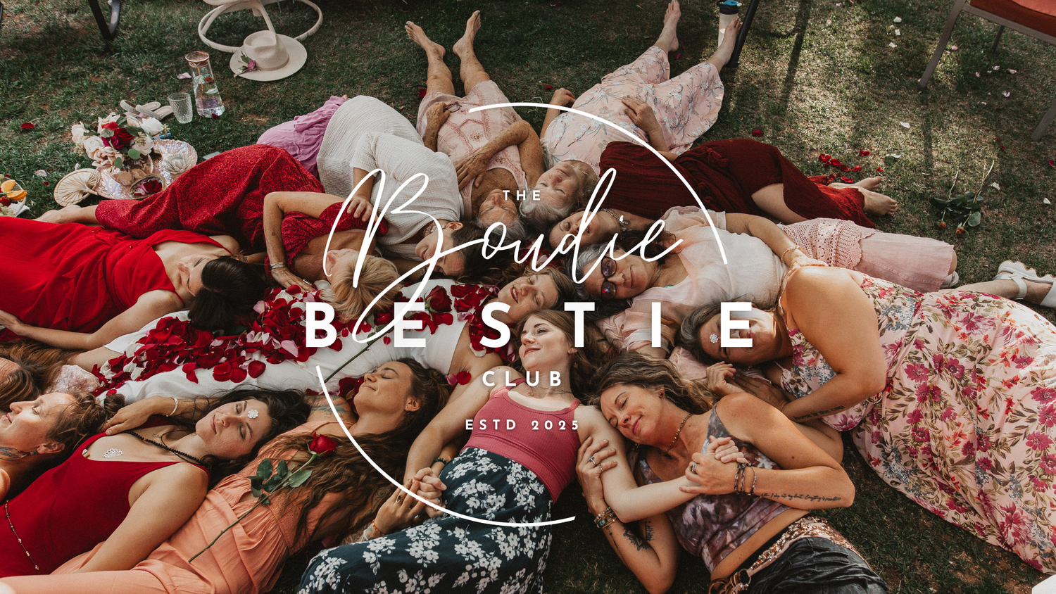 A group of people lying in a circle on grass creating a peaceful, bohemian-style outdoor photograph.