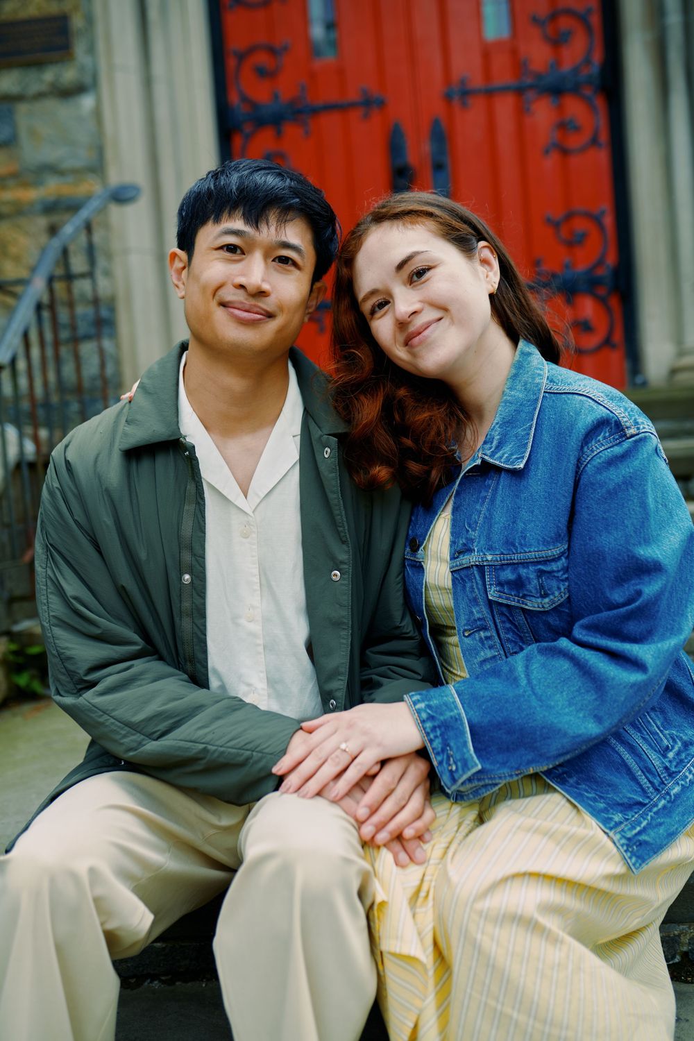 A couple in casual wear sits closely together on stone steps, shown in a series of intimate candid moments Wave hill garden