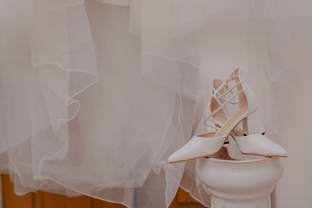 White tulle wedding dress details with delicate lace and beading.