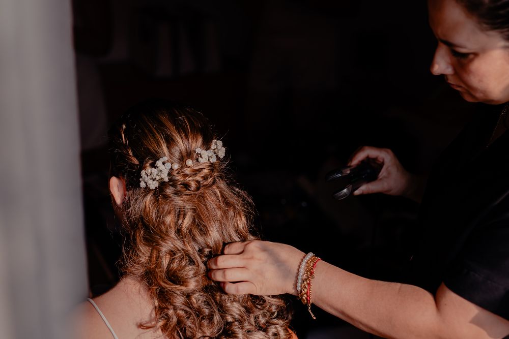 Wedding preparation details with elegant hair styling and accessories.
