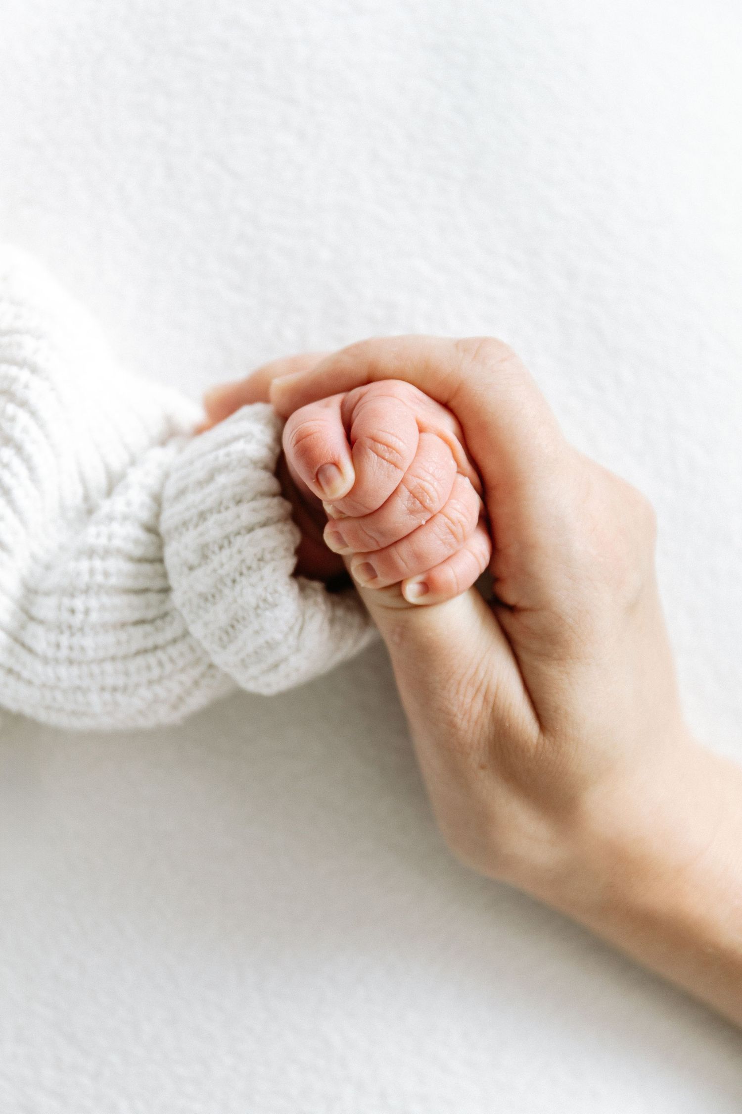 Baby photographer Nottingham studio session relaxed newborn close up tiny hands detail shot