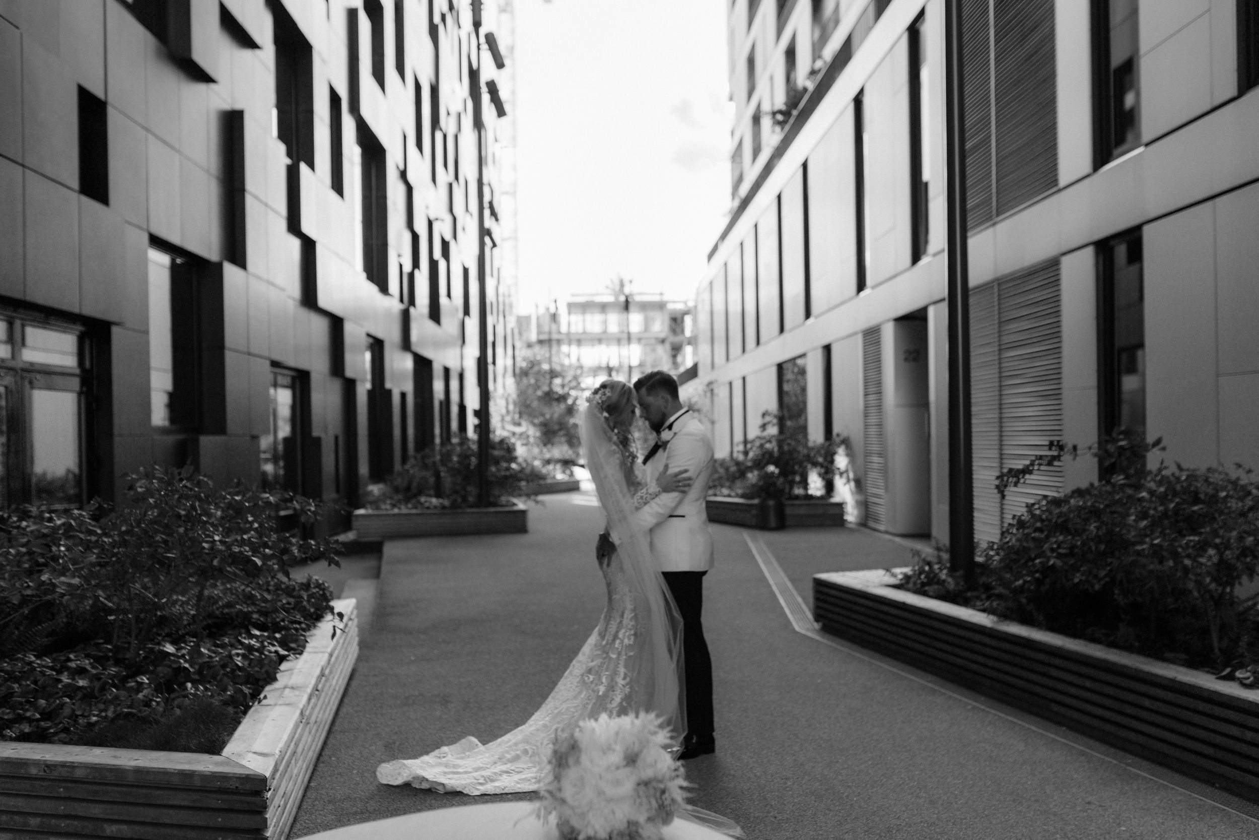 Urban wedding photography featuring modern architecture and clean geometric lines.
