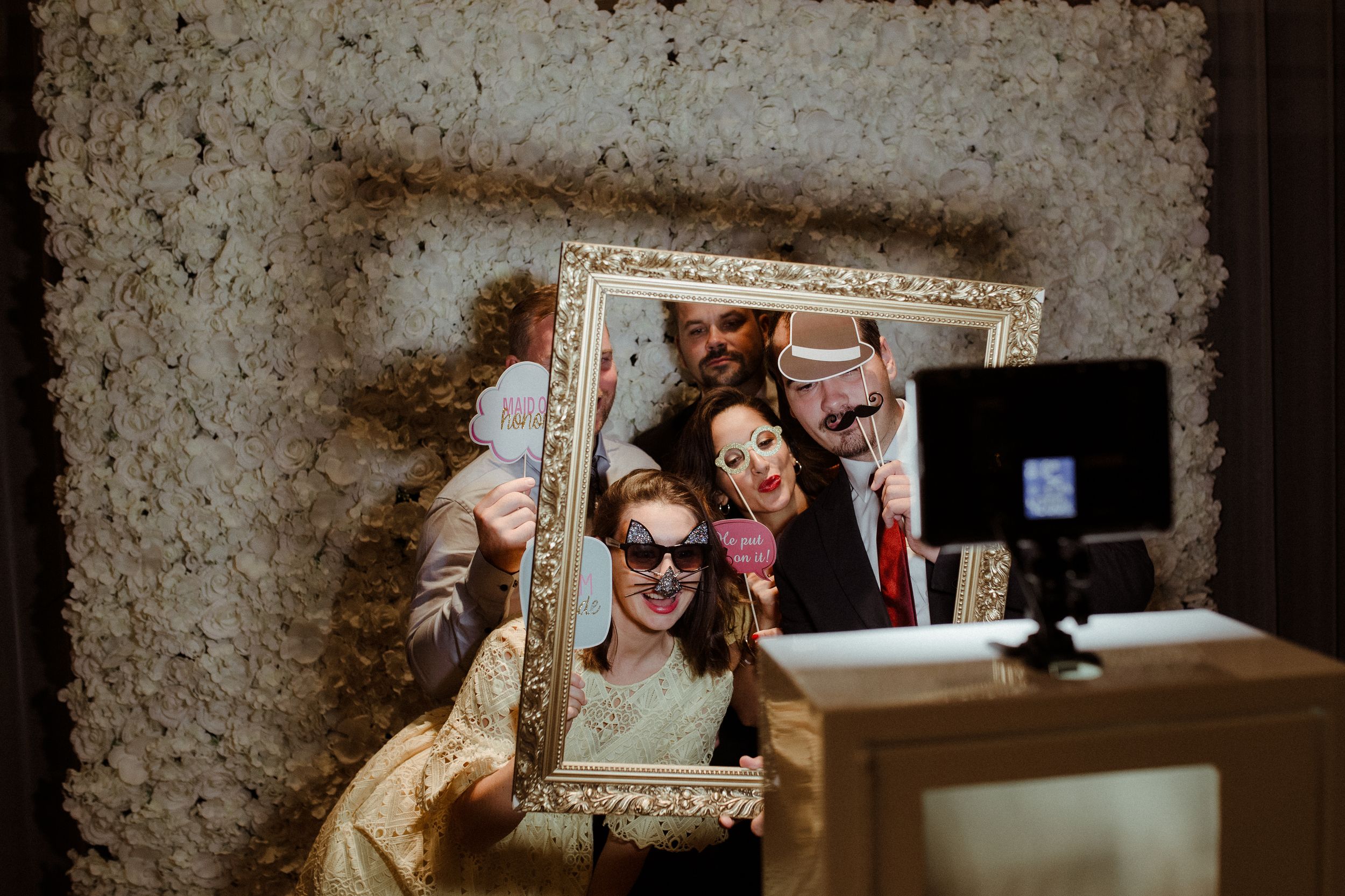 Antique frames displayed on textured wall with vintage aesthetic.