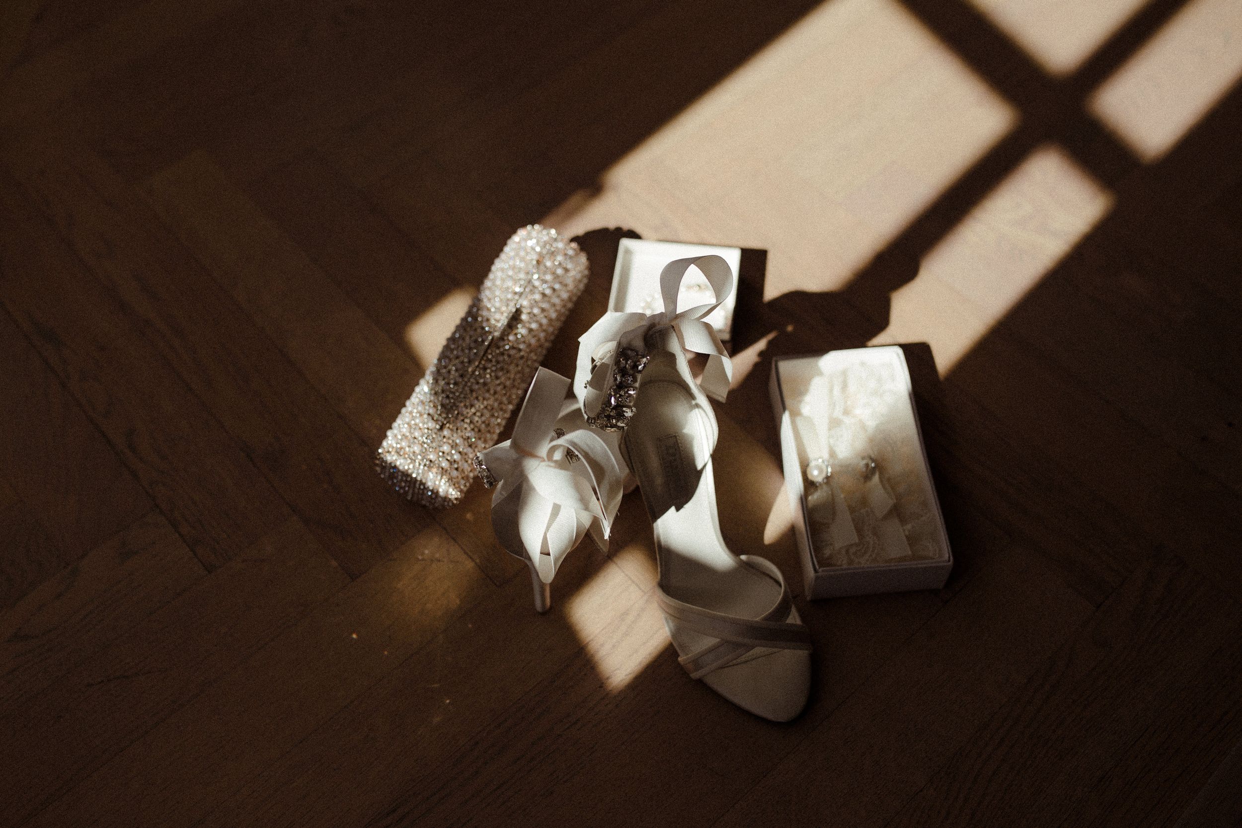 Artistically arranged wedding details captured in natural window light.