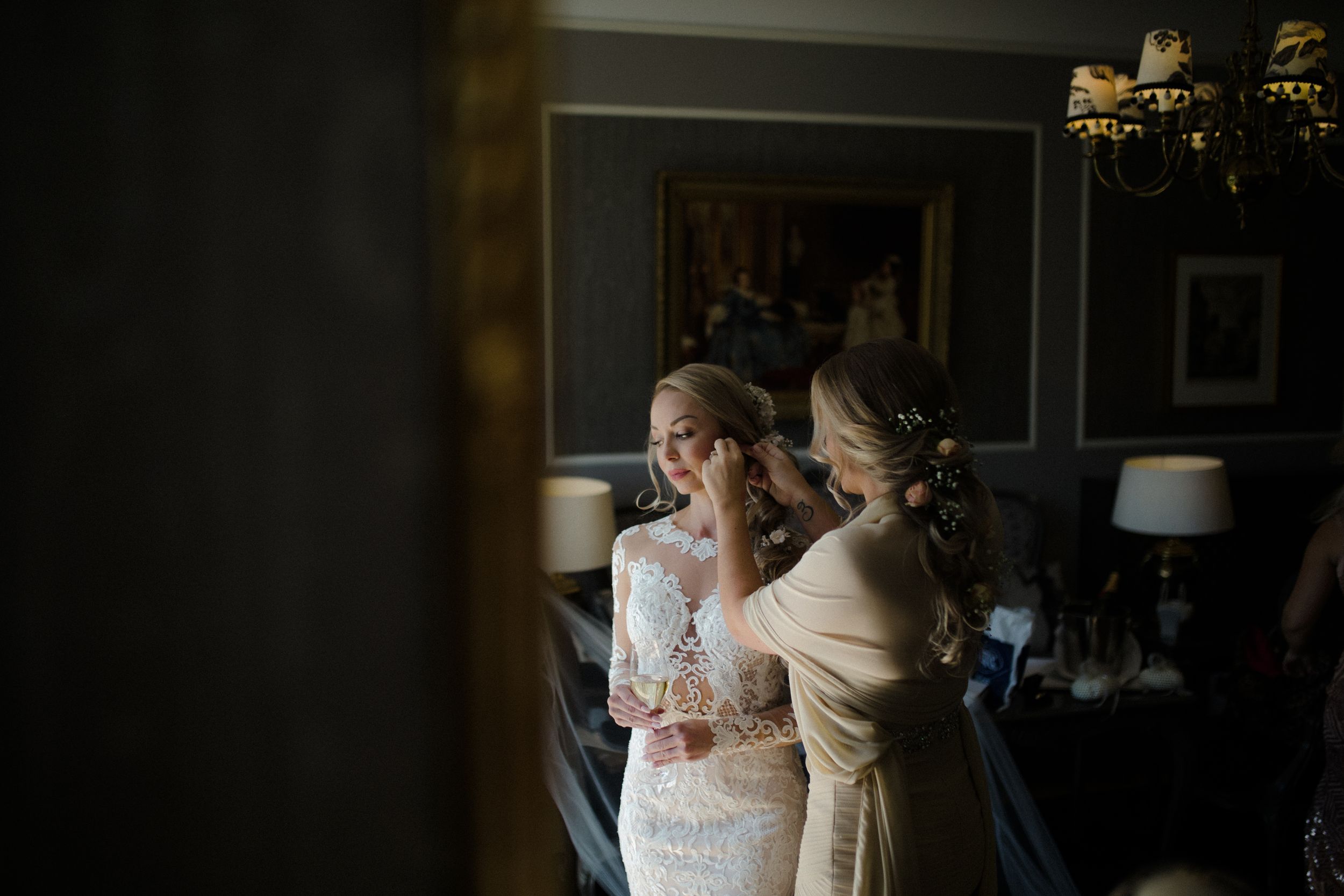 Natural light streams through windows onto elegant bridal gowns displayed in a boutique setting.