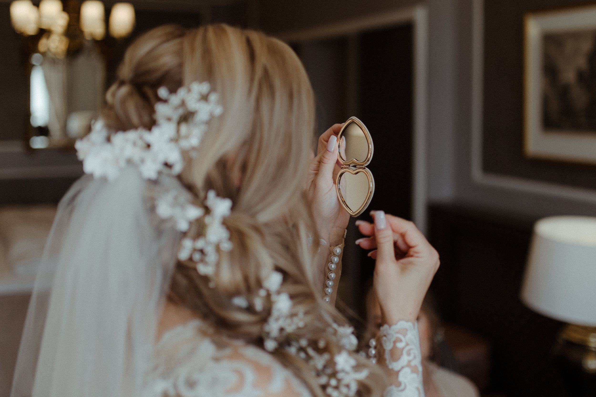Close-up detail of intricate bridal hair accessories and veil.