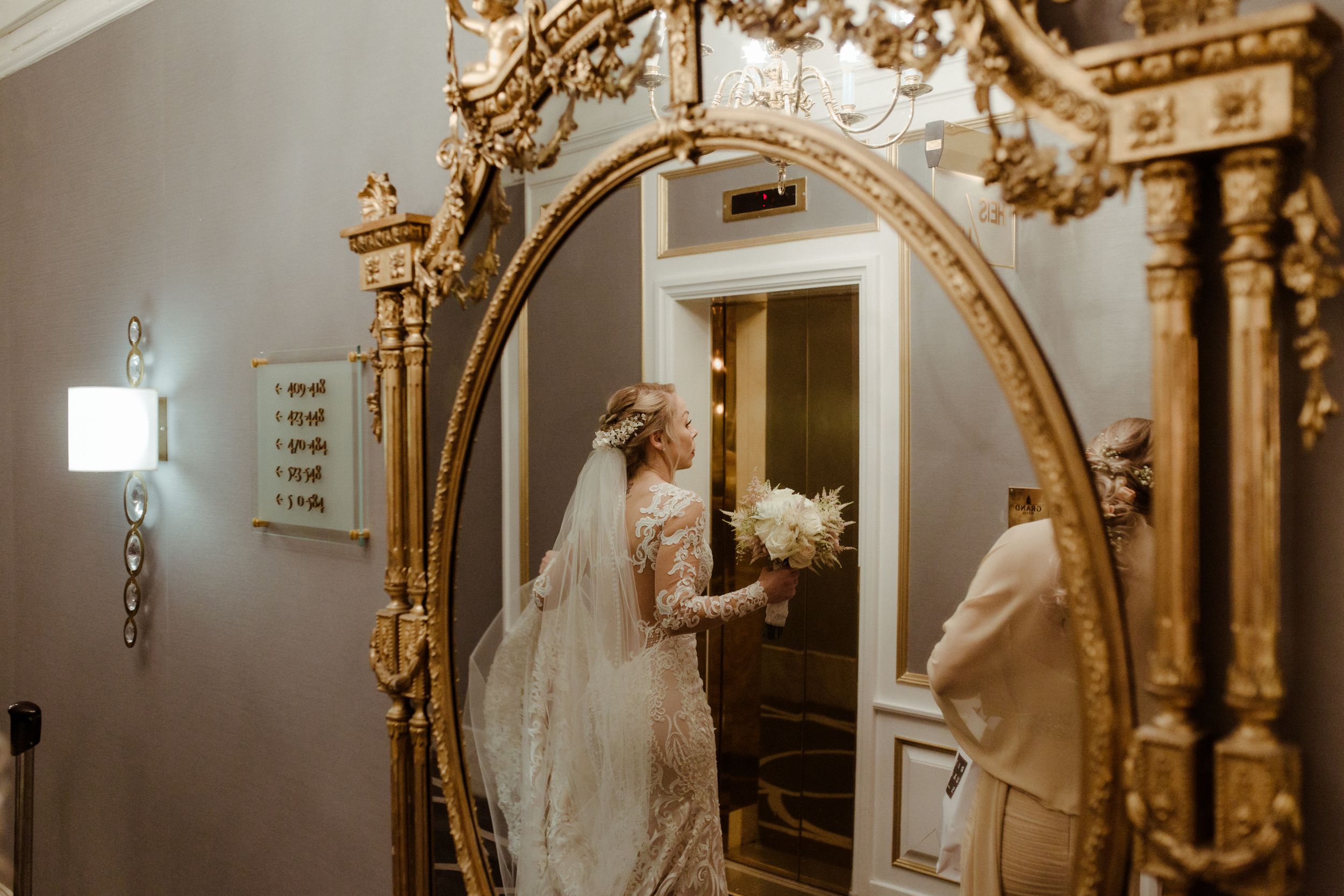 Ornate gold-framed mirrors in an elegant bridal suite interior.