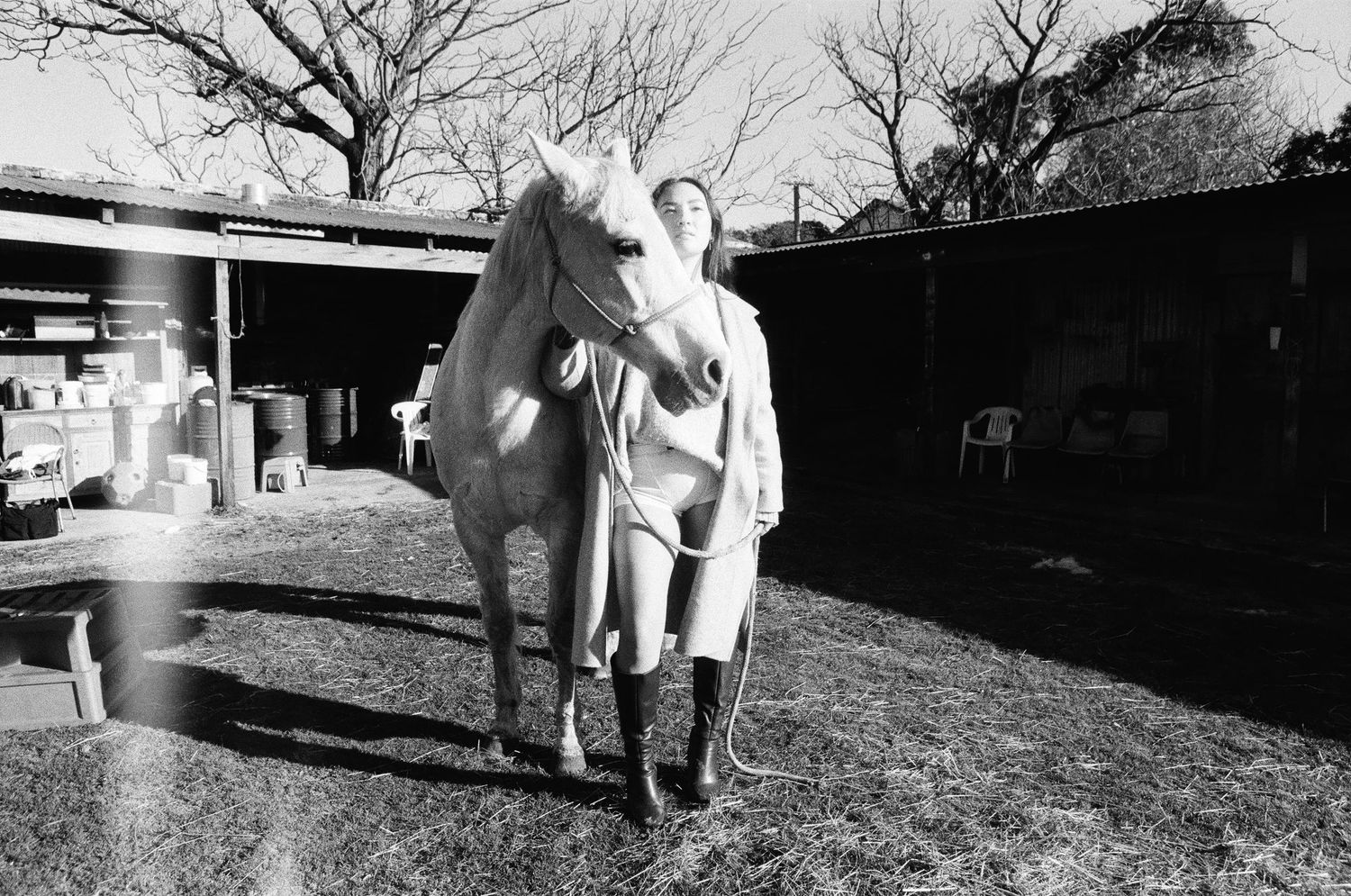 Film portrait of woman standing beside horse at Randwick Stables Perth