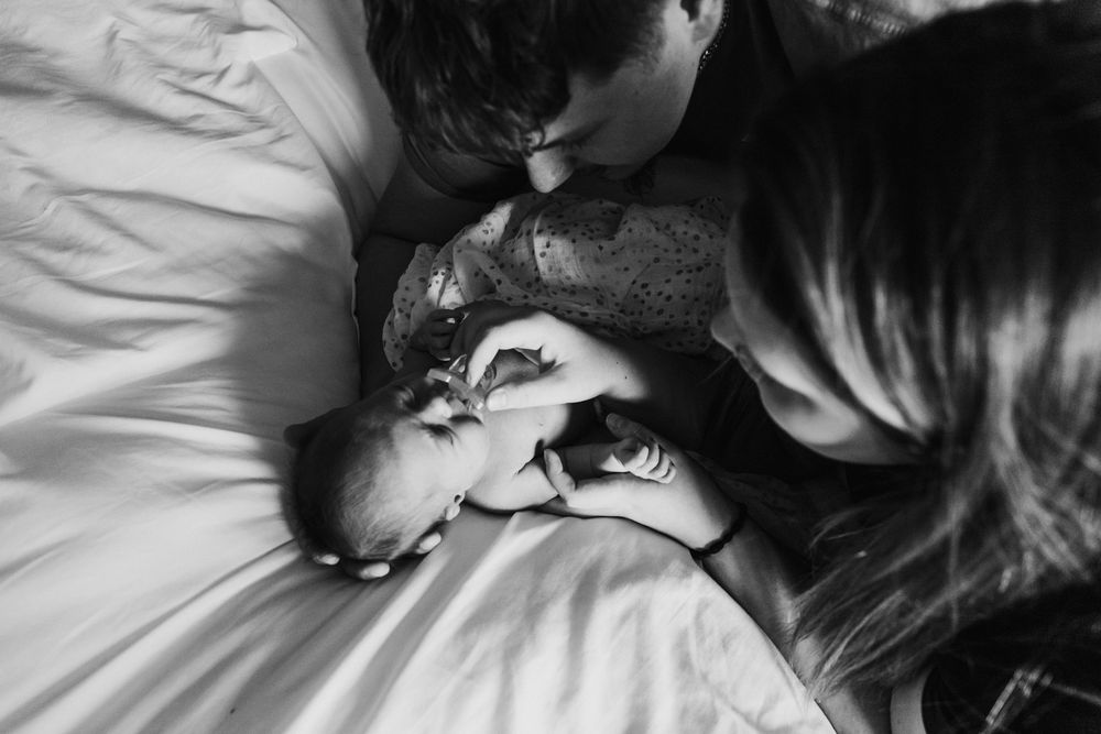 A tender black and white photograph showing a parent and child bonding terre haute family wedding photographer parke county