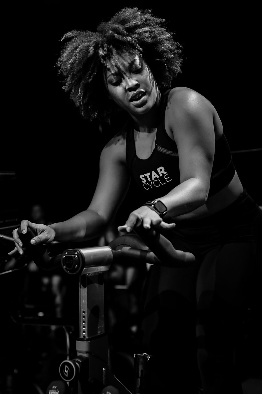 A black and white action image of professional fitness instructor