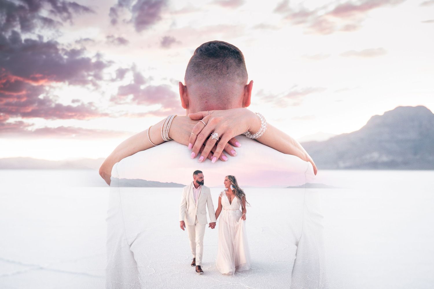 A couple in wedding attire holds hands on white salt flats, with a double exposure of clasped hands against a pastel sky.