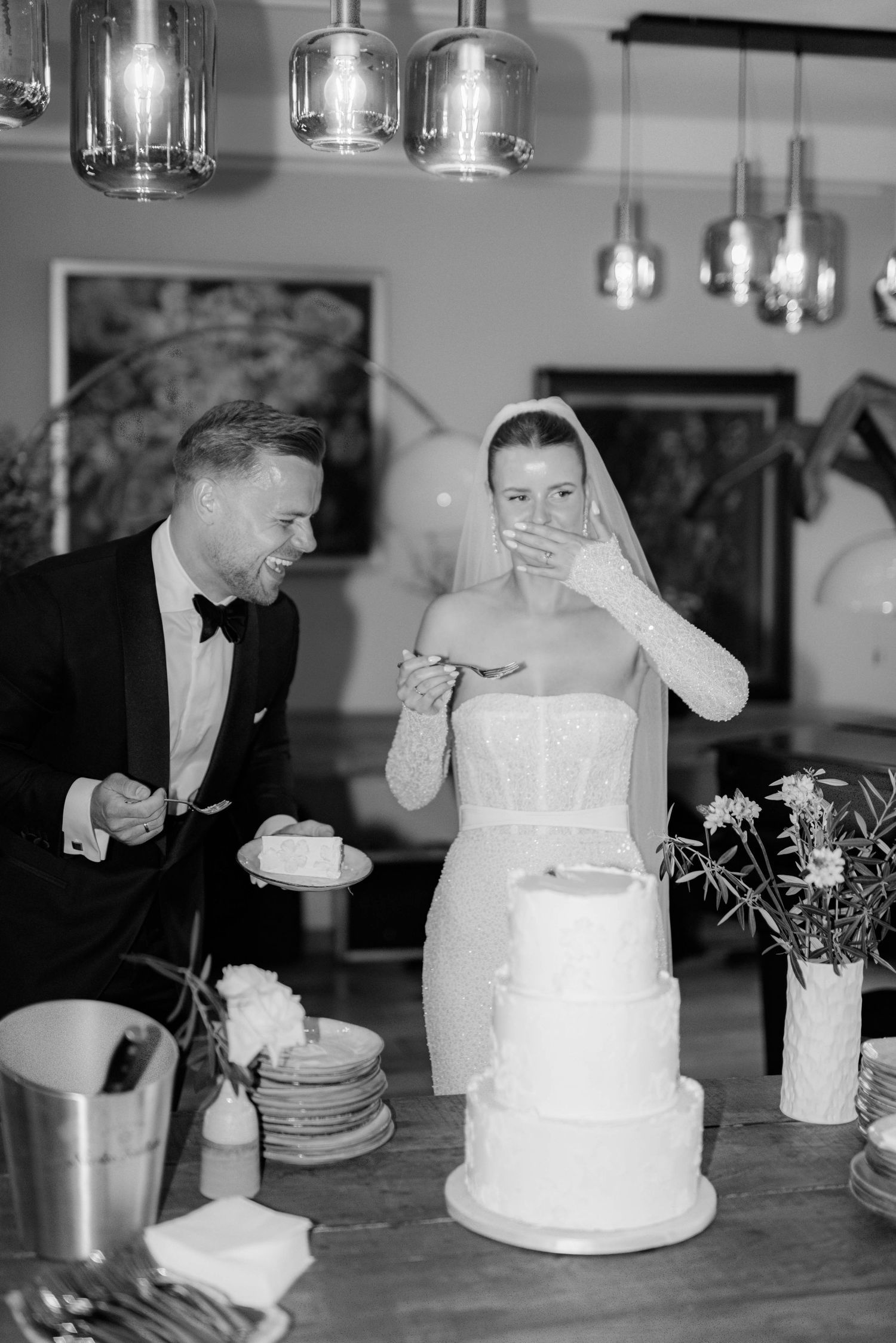 A black and white photo series showing a couple cutting their wedding cake in traditional ceremonial style.