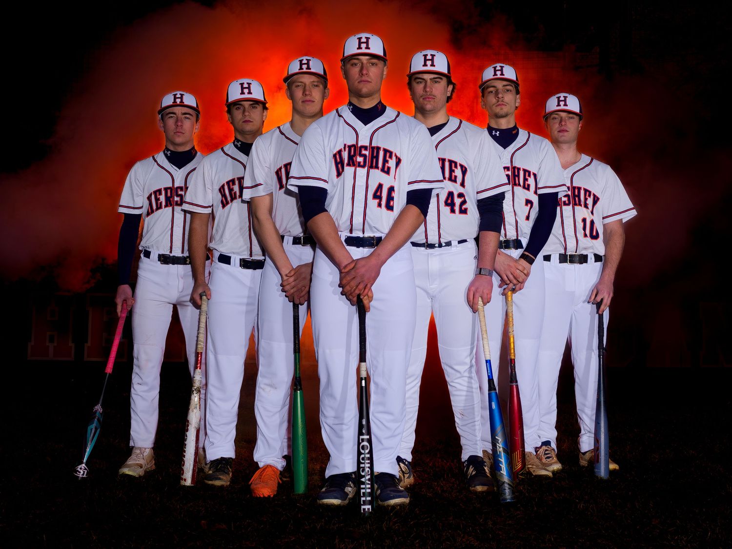 Hershey High School baseball players posed with bats and smoke effects at Media Day, by Deanna Fox, SportsFox Photography, Hershey PA