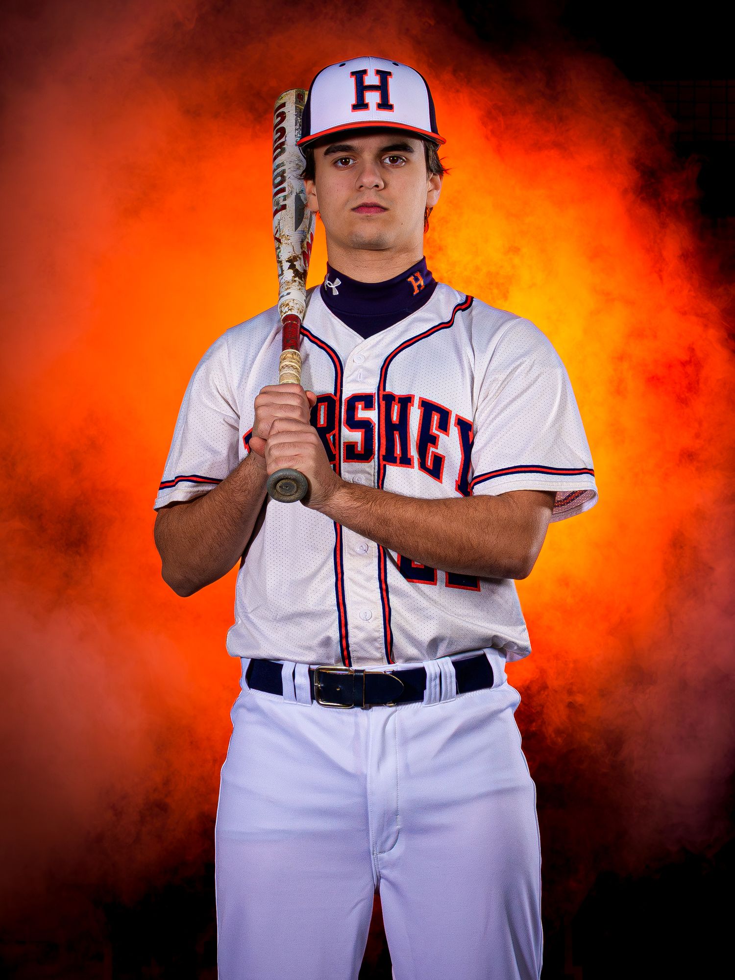 Hershey High School baseball player holding bat upright with smoke effects at Media Day, by Deanna Fox, SportsFox Photography, Hershey PA