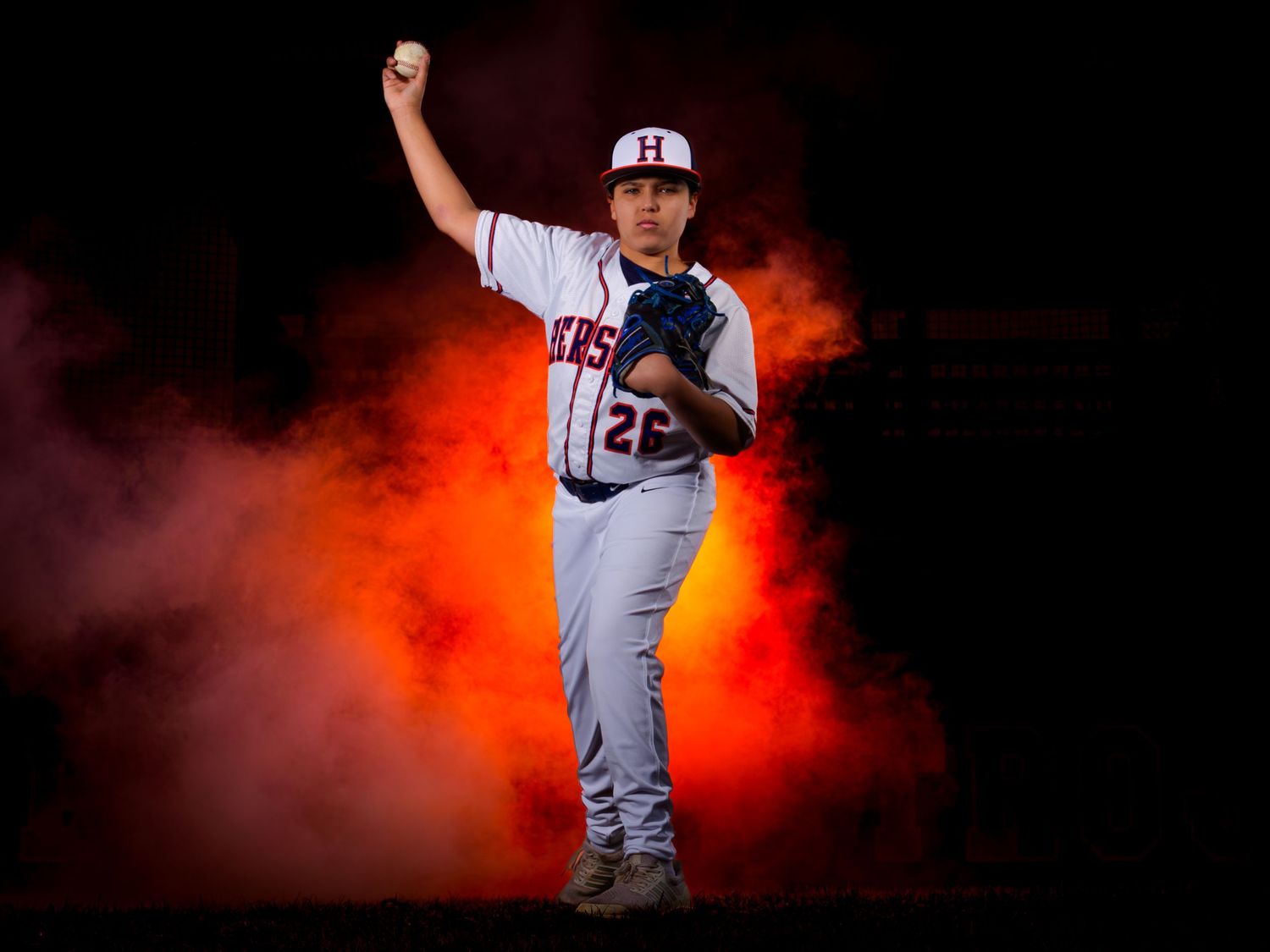 Hershey High School pitcher posed with fist raised for Media Day, by Deanna Fox, SportsFox Photography, Hershey PA
