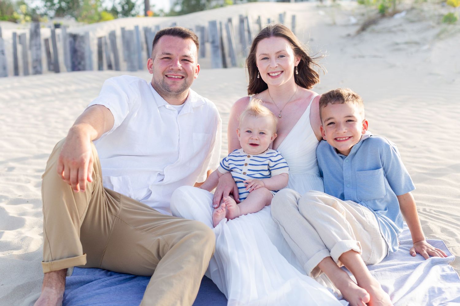 Family portrait on the beach in Isla Verde, Carolina, Puerto Rico. Father, mother and two sons.