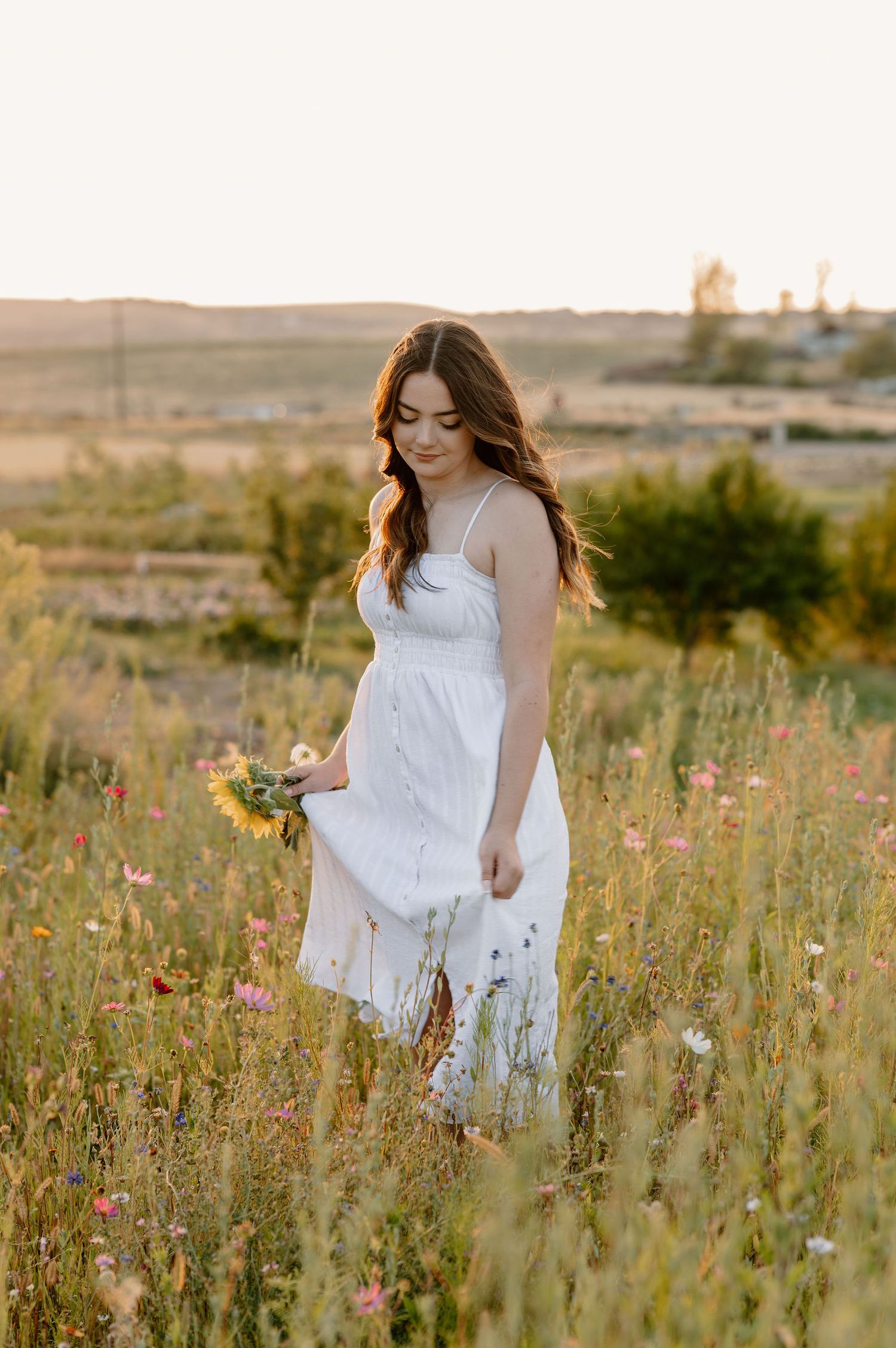 2026 senior stands in wildflowers at Haven Flower Farm in Tri-Cities, WA