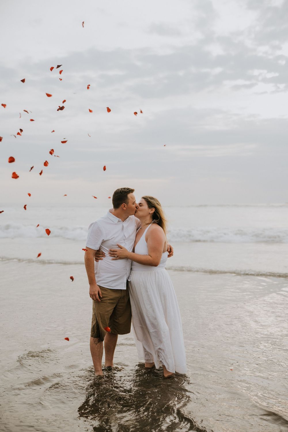 Professional surprise proposal photography at Petitenget Beach.