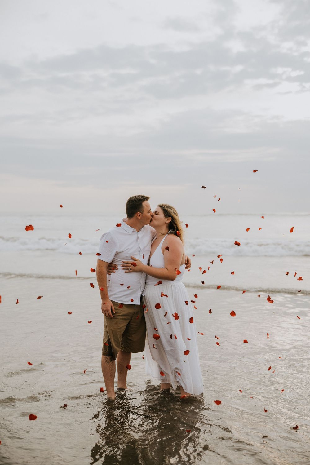 Professional surprise proposal photography at Petitenget Beach.