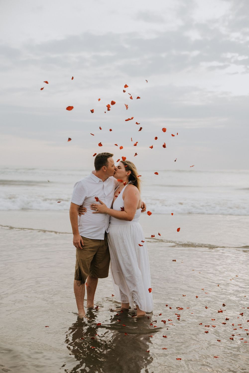 Professional surprise proposal photography at Petitenget Beach.