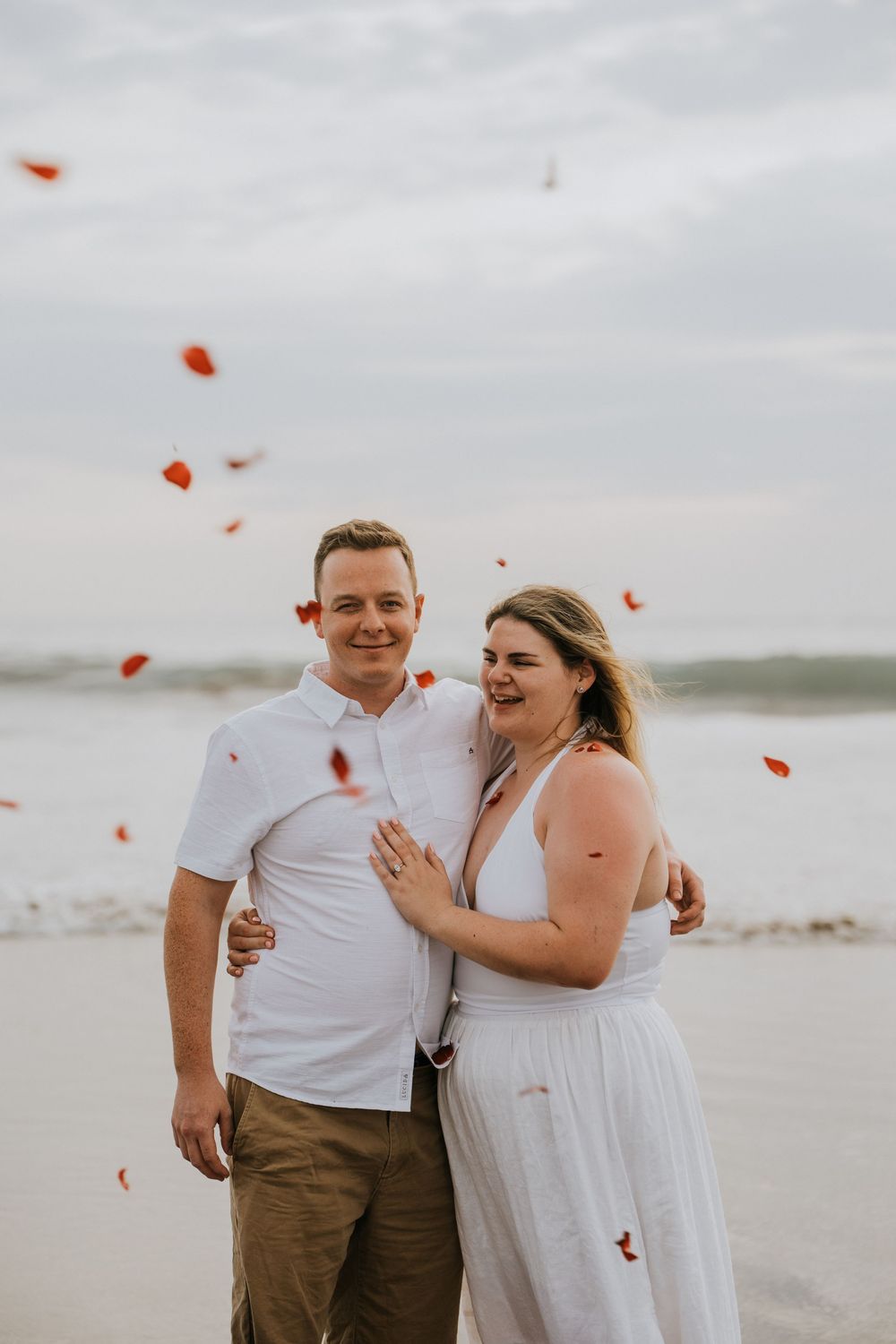 Professional surprise proposal photography at Petitenget Beach.