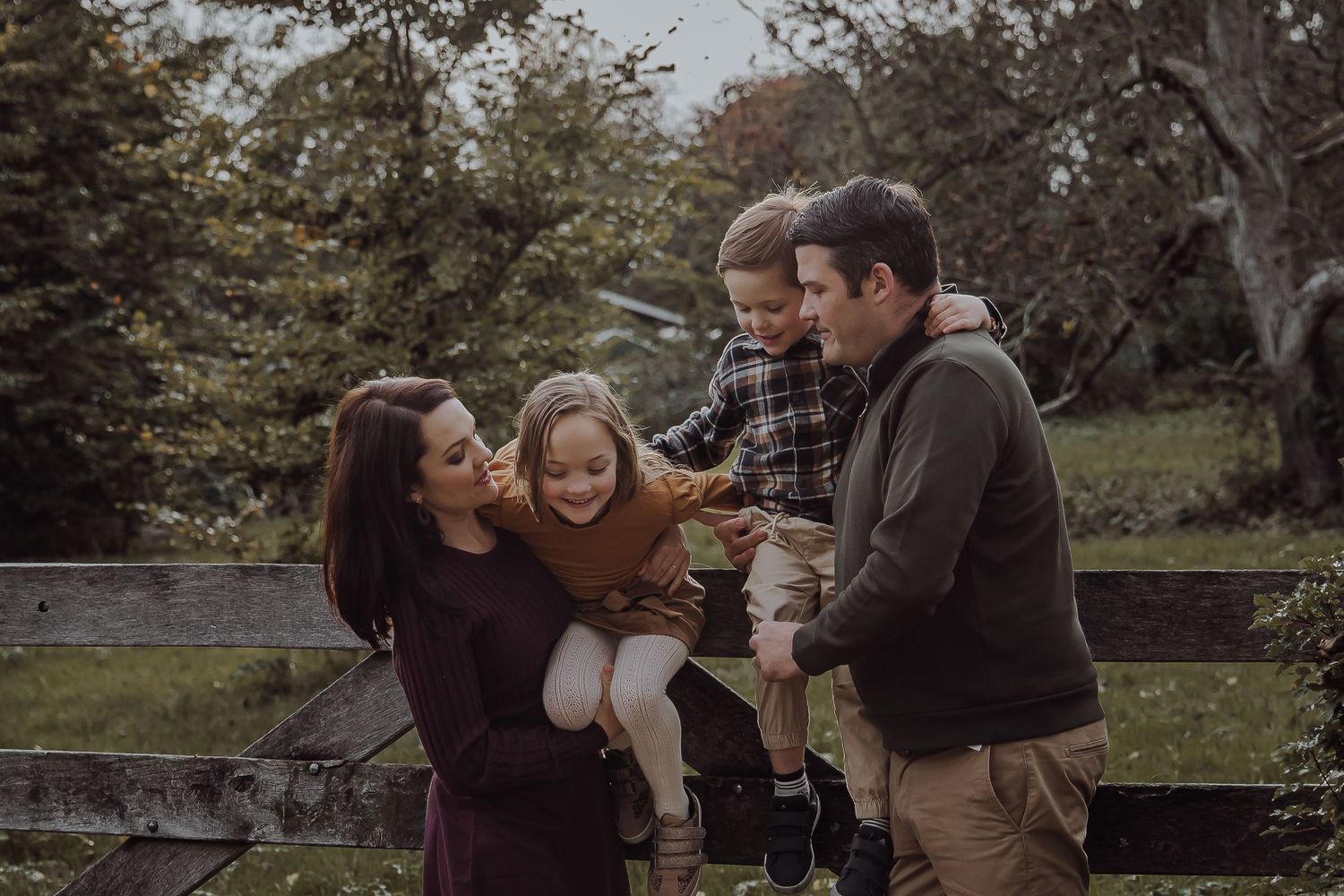 Siblings laughing and playing together during a family photography session in the Netherlands