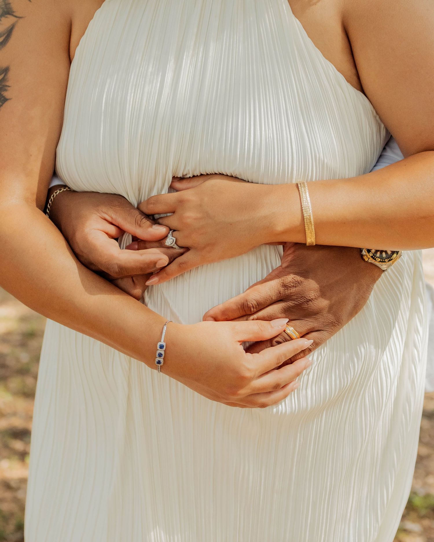 couples rings close up elopement