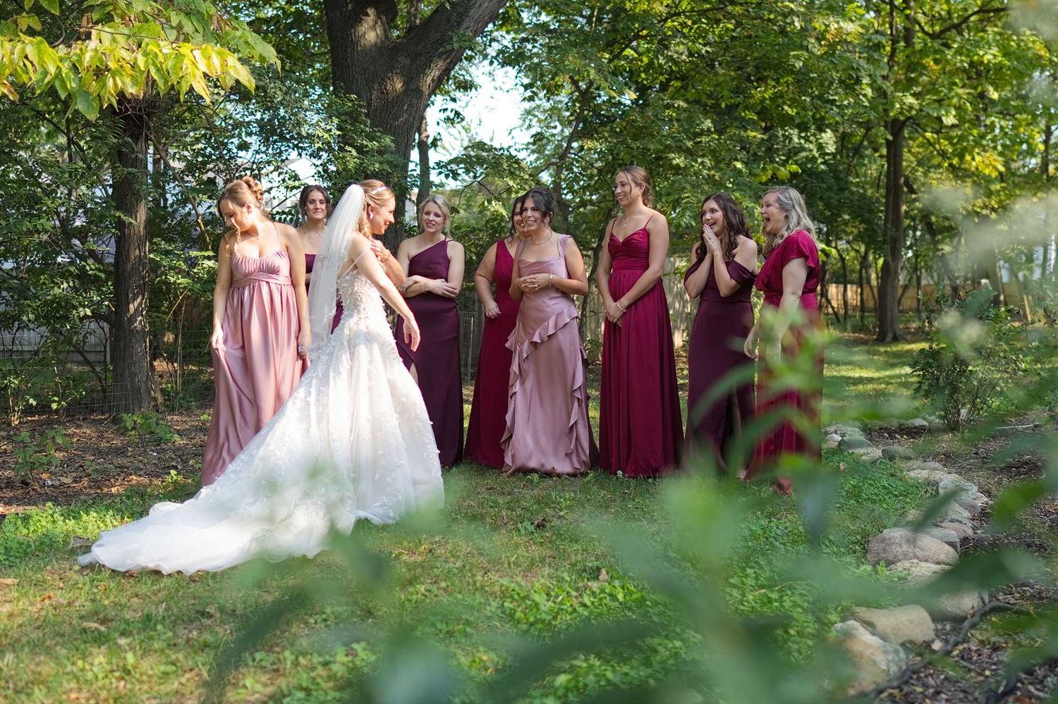 Bride in white gown reveals dress to bridesmaids in The Westin Great Southern Columbus Wedding Venue
