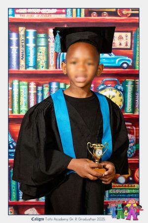 An image of boy school child at their Grade R graduation.