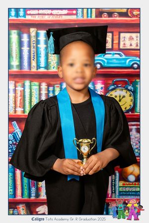 An image of boy school child at their Grade R graduation, looking