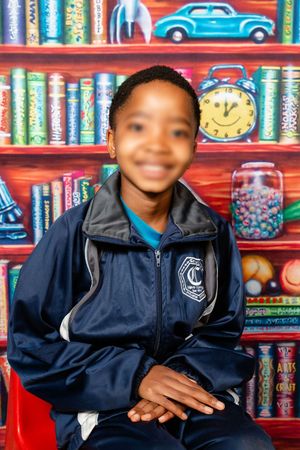 School portrait image of a preschool learner smiling at the camera