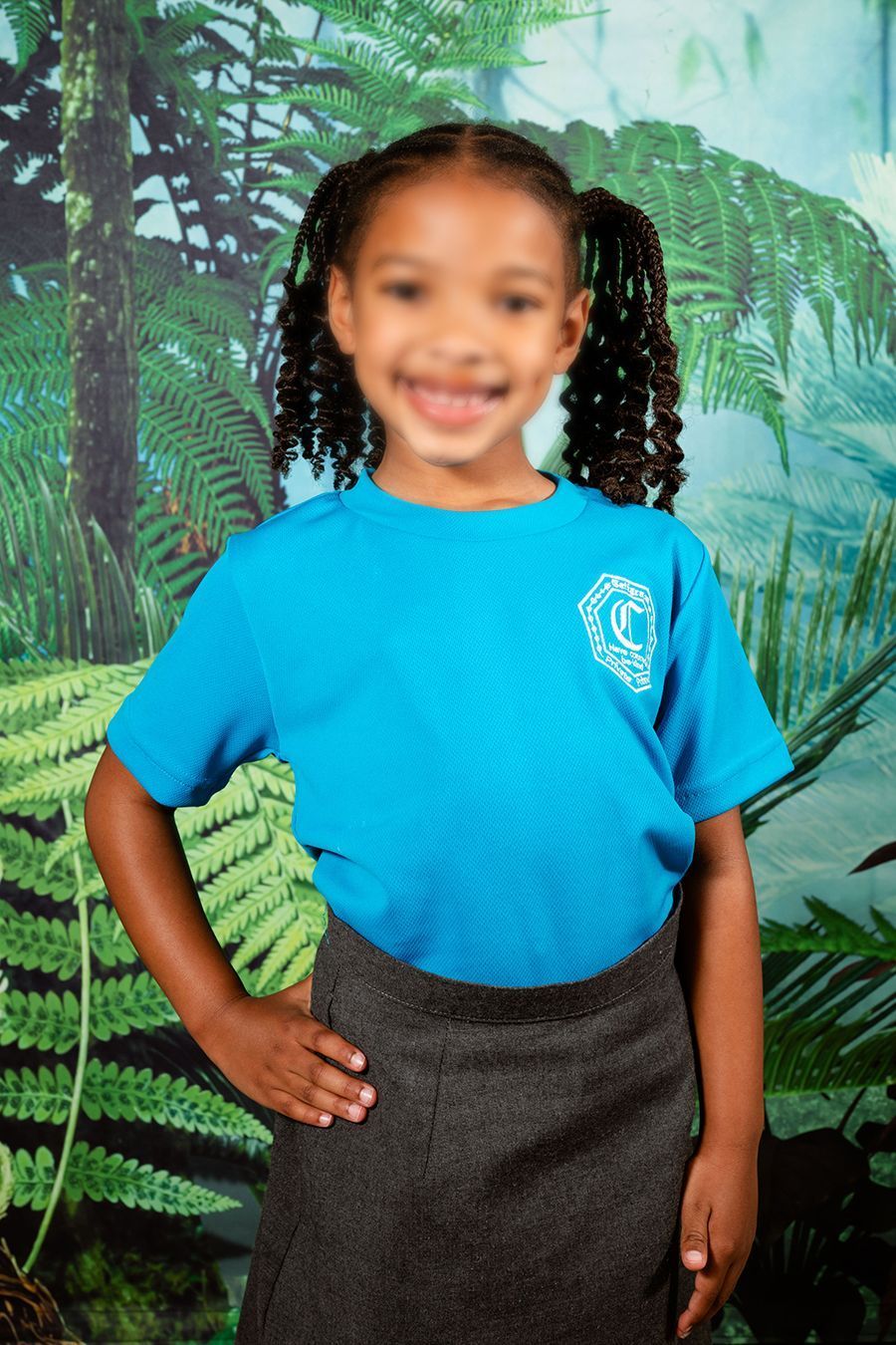 A smiling scholar, posing for their photo day portrait.