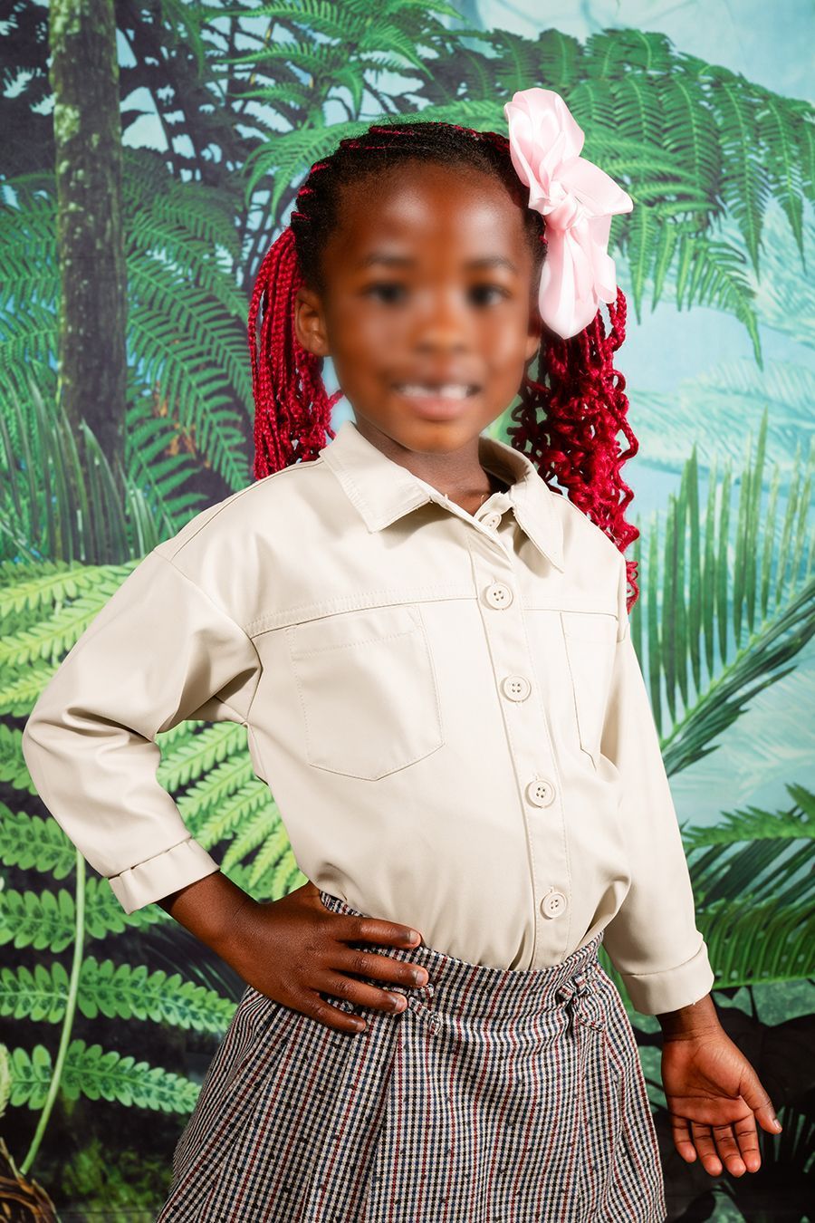 Picture day picture of a preschooler, smiling at the camera.
