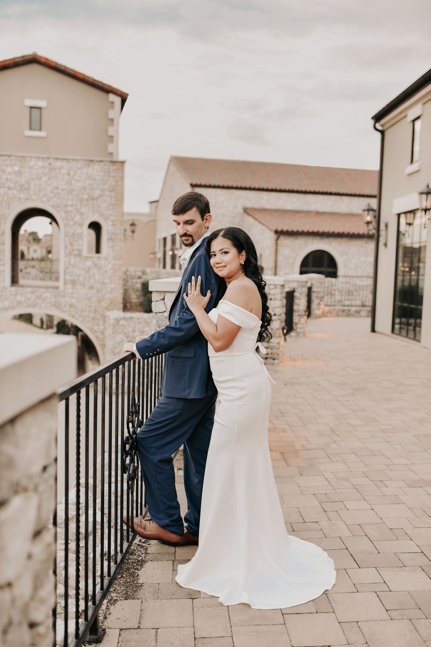 Couple sharing a quiet moment during their sunset engagement session at Chapel at Palacios