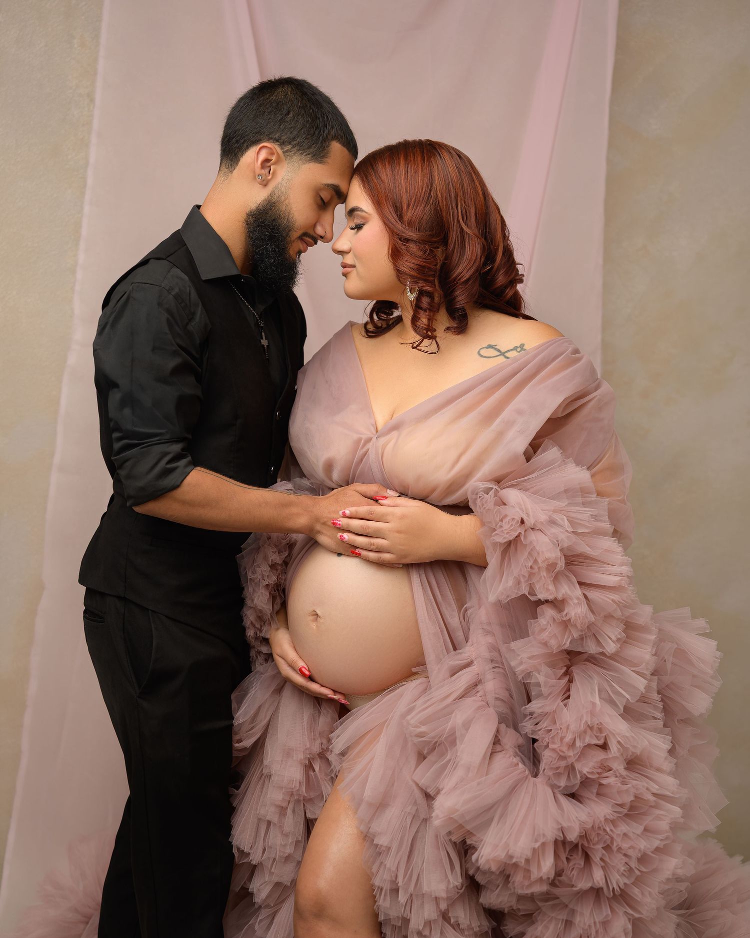 Expecting parents during an elegant studio maternity photography session serving Tampa Bay, Florida