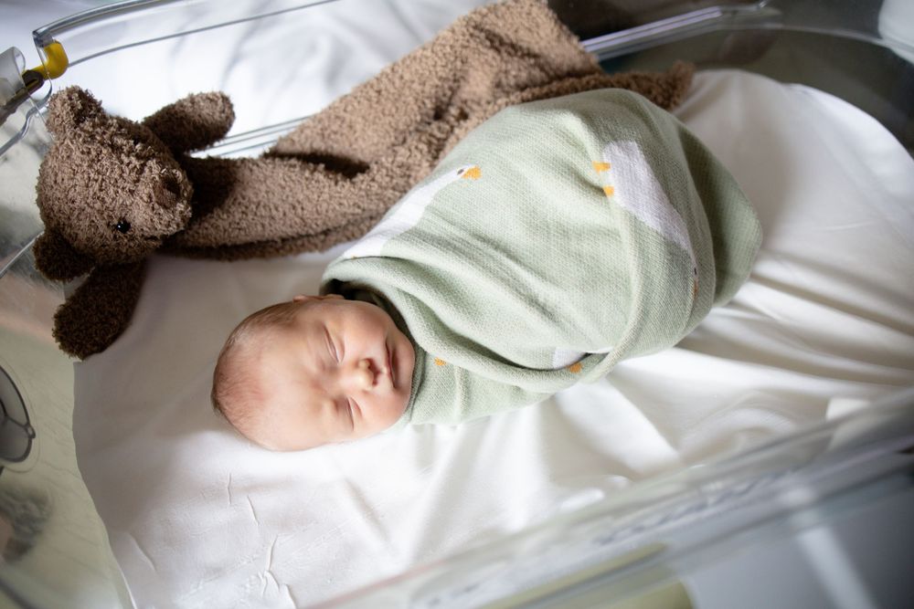 Newborn baby swaddled during fresh 48 session at the University of Tennessee with Nina Thomas Photography.