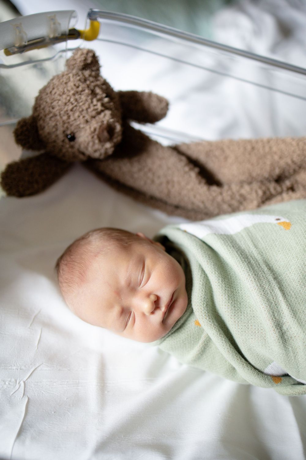 Newborn baby swaddledduring fresh 48 session at the University of Tennessee with Nina Thomas Photography.