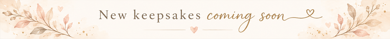 Elegant banner with floral accents announcing new keepsakes coming soon in soft pink and beige tones.