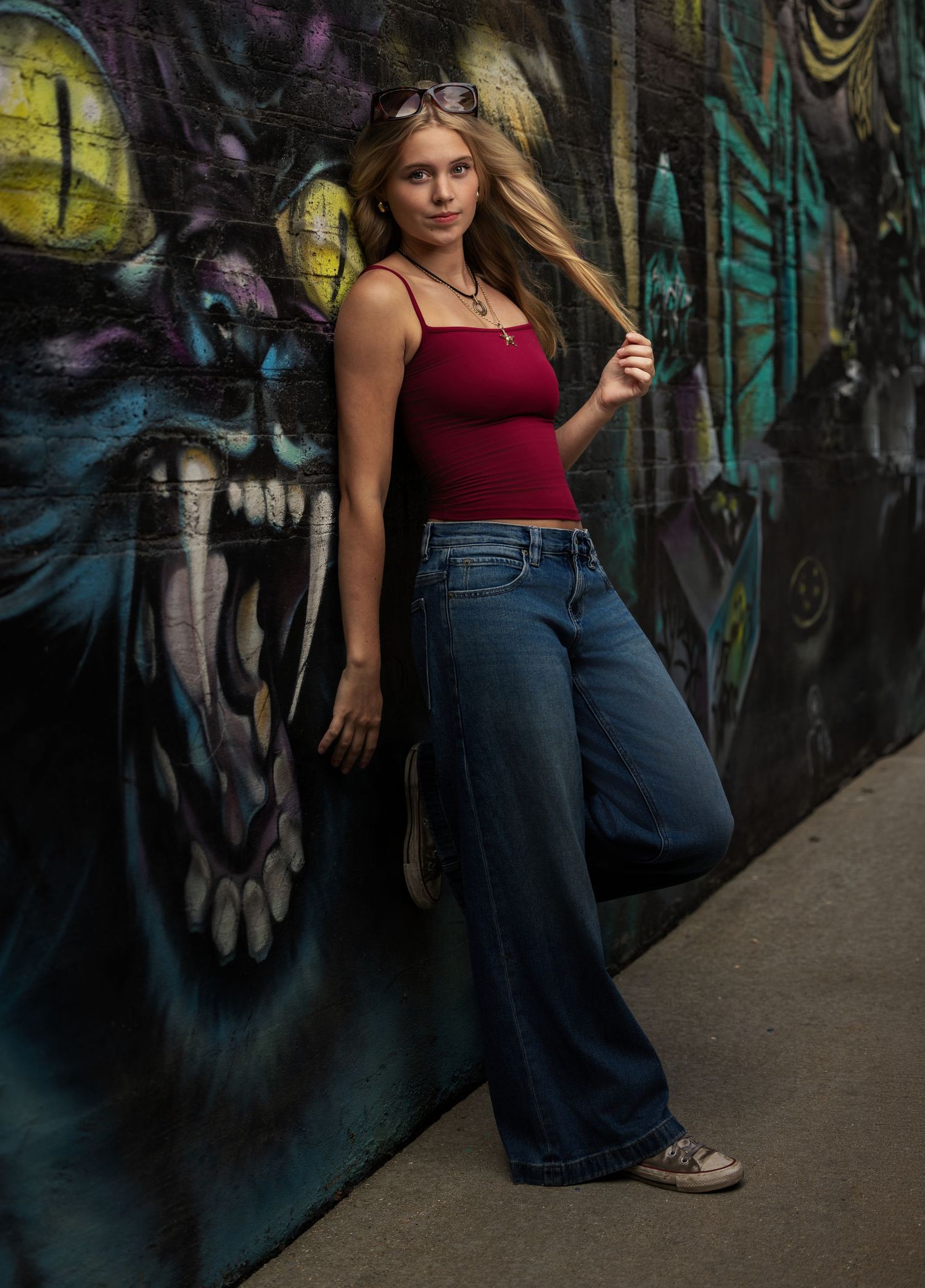 Urban senior portrait of a girl photographed near colorful graffiti