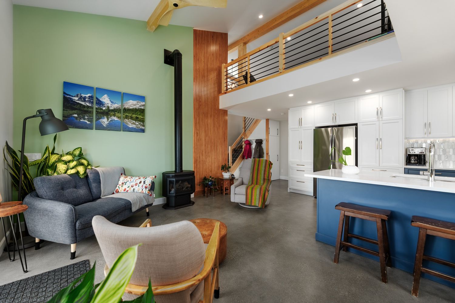 Open-plan Calgary home interior with kitchen and living area, photographed by RezinMedia