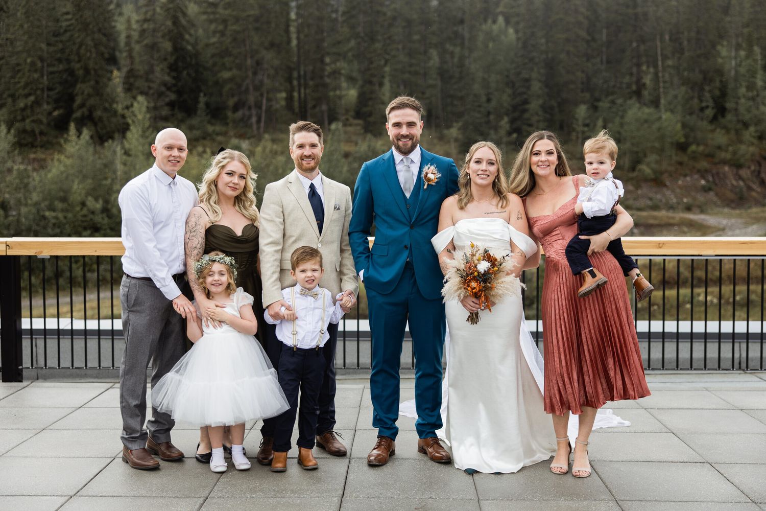Wedding party and family portrait with evergreen hills at Vista Canmore