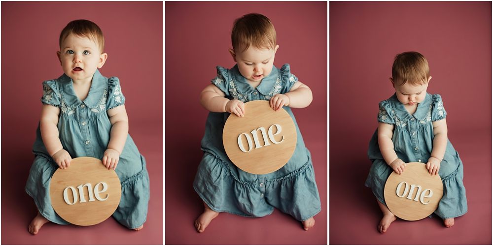 A baby girl in a teal dress sits holding a round wooden sign reading one, shown in a triptych for her first birthday.