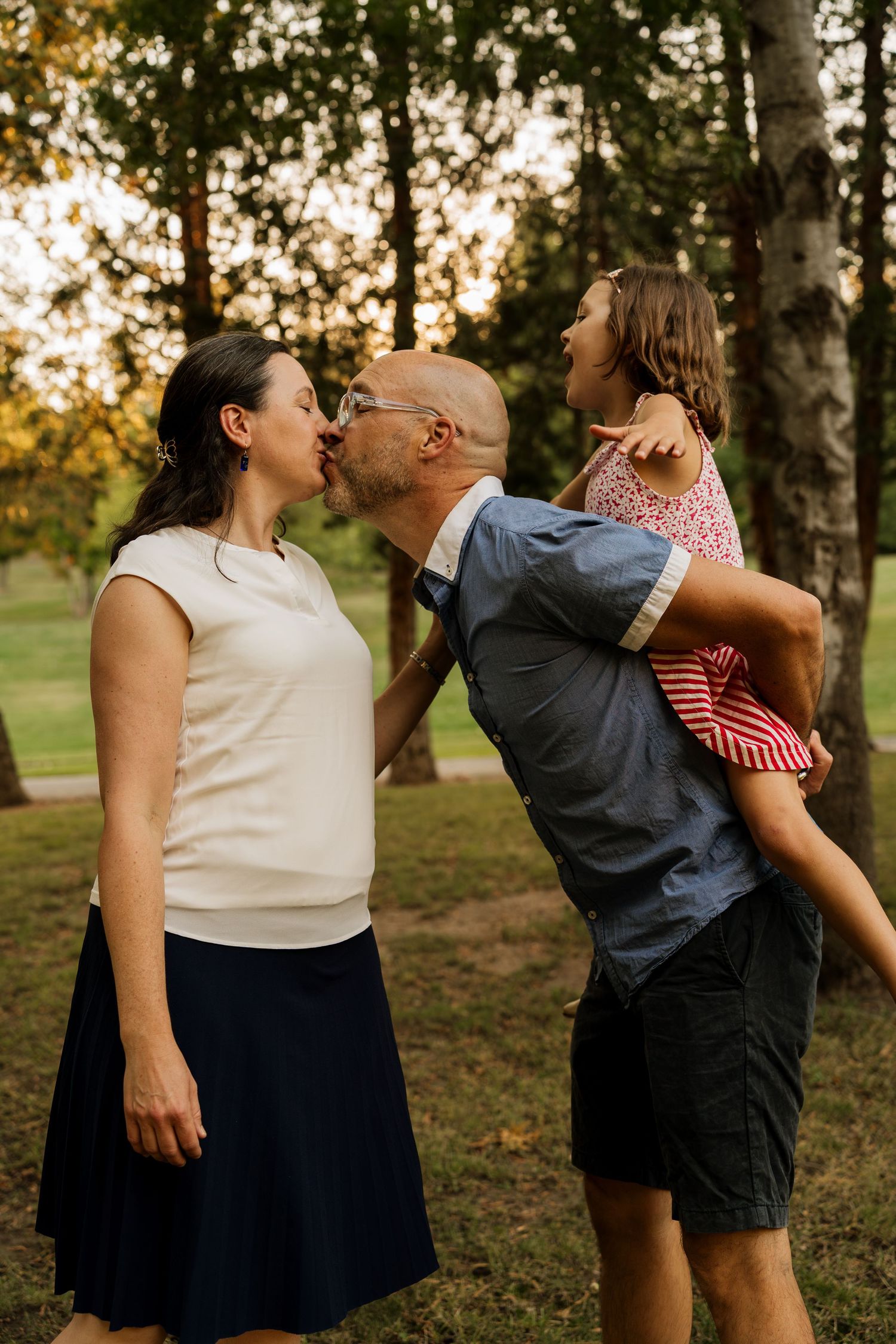 Candid family moment with mom, dad, and daughter