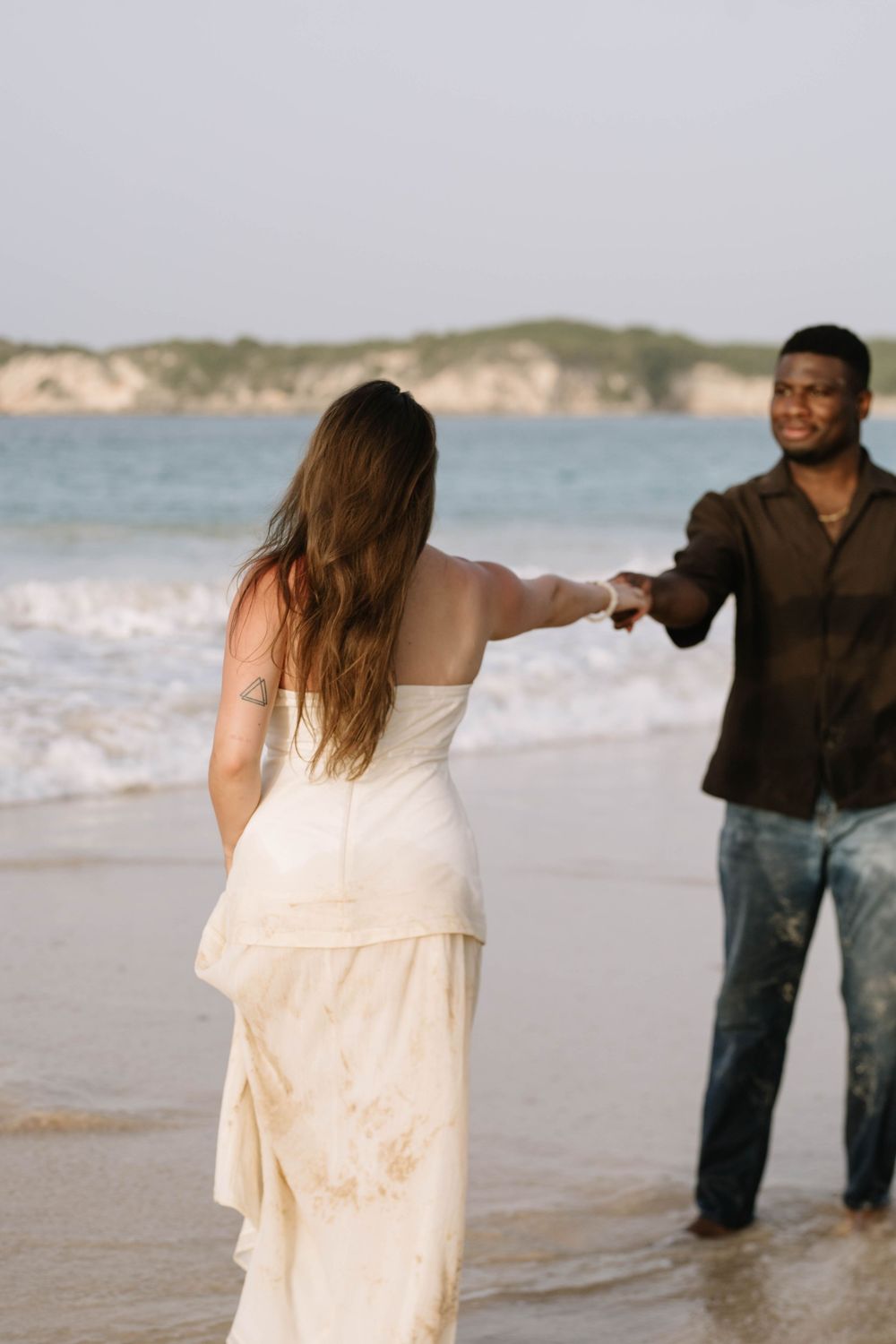 Dreamy beach engagement session in Punta Cana capturing laughter, love, and unforgettable Caribbean memories.