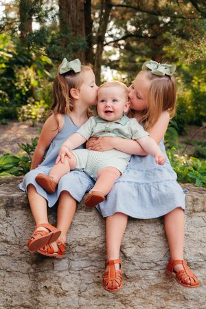 A photo of 3 little siblings